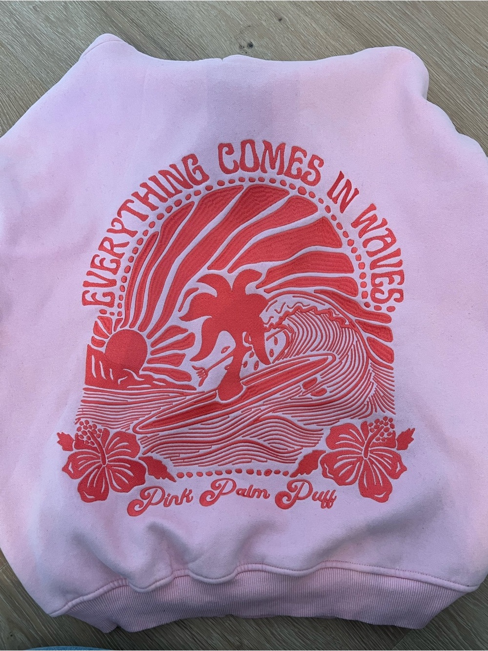 Pink palm puff “everything comes in waves” hoodie